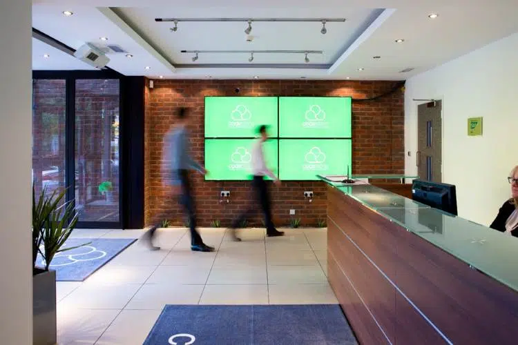 Office workers entering the codestone building